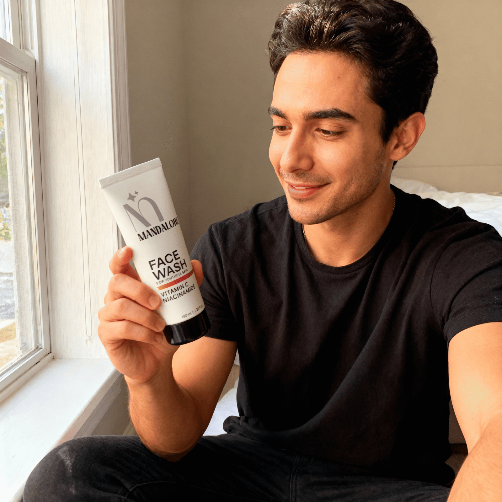 freepik__a-man-holding-img1-in-one-hand-and-looking-at-it-w__26459